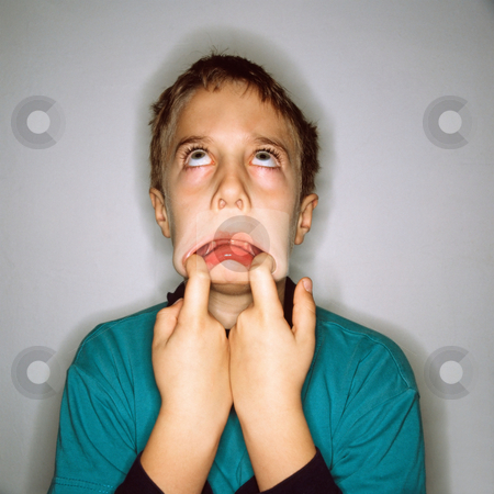 To use this stock image in your creative project, please select the size you need over to the right and click the "Add to Cart" button.
Your downloaded image will come with the Cutcaster watermark removed so don’t worry about the watermark you see on this page. MPIXIS550747 stock photo, Boy making faces by Mpixis World