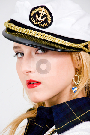 To use this stock image in your creative project, please select the size you need over to the right and click the "Add to Cart" button.
Your downloaded image will come with the Cutcaster watermark removed so don’t worry about the watermark you see on this page. Cool blond young woman stock photo, Blond young woman in a sea peak-cap by Vitaly Sokolovskiy