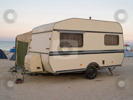 To use this stock image in your creative project, please select the size you need over to the right and click the "Add to Cart" button.
Your downloaded image will come with the Cutcaster watermark removed so don’t worry about the watermark you see on this page. Caravan trailer stock photo, Caravan traileron the beach sunset by Adrian Costea