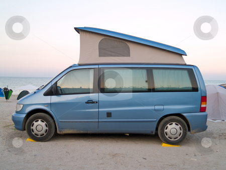 To use this stock image in your creative project, please select the size you need over to the right and click the "Add to Cart" button.
Your downloaded image will come with the Cutcaster watermark removed so don’t worry about the watermark you see on this page. Caravan car stock photo, Caravan car on the beach sunset by Adrian Costea