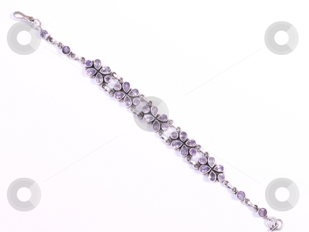To use this stock image in your creative project, please select the size you need over to the right and click the "Add to Cart" button.
Your downloaded image will come with the Cutcaster watermark removed so don’t worry about the watermark you see on this page. Purple silver bracelet2 stock photo, Purple bracelet on white isolated background by Adrian Costea