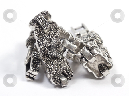 To use this stock image in your creative project, please select the size you need over to the right and click the "Add to Cart" button.
Your downloaded image will come with the Cutcaster watermark removed so don’t worry about the watermark you see on this page. Silver bracelet stock photo, Bracelet on white isolated background by Adrian Costea