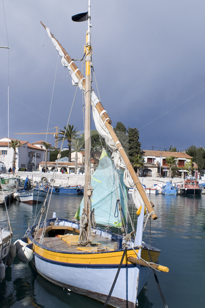 To use this stock image in your creative project, please select the size you need over to the right and click the "Add to Cart" button.
Your downloaded image will come with the Cutcaster watermark removed so don’t worry about the watermark you see on this page. Old sailing boat stock photo, Traditional sailing boat in French Riviera. by Serge VILLA