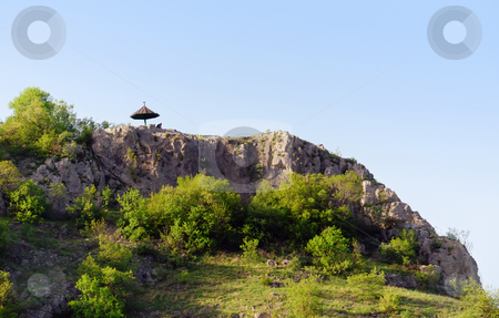 To use this stock image in your creative project, please select the size you need over to the right and click the "Add to Cart" button.
Your downloaded image will come with the Cutcaster watermark removed so don’t worry about the watermark you see on this page. Man under umbrella stock photo, A man under umbrella on the top of a rock by Ivan Paunovic