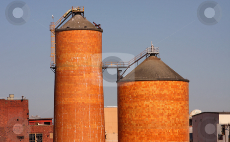 To use this stock image in your creative project, please select the size you need over to the right and click the "Add to Cart" button.
Your downloaded image will come with the Cutcaster watermark removed so don’t worry about the watermark you see on this page. Brick Silos stock photo, Two brick silos from a pulp mill with blue sky background. by Steve Stedman