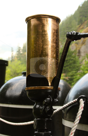 To use this stock image in your creative project, please select the size you need over to the right and click the "Add to Cart" button.
Your downloaded image will come with the Cutcaster watermark removed so don’t worry about the watermark you see on this page. Steam Train Whistle stock photo, Brass steam train whistle in the rain. by Steve Stedman