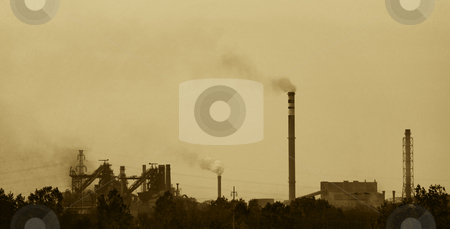 To use this stock image in your creative project, please select the size you need over to the right and click the "Add to Cart" button.
Your downloaded image will come with the Cutcaster watermark removed so don’t worry about the watermark you see on this page. Plant stock photo, Sepia toned photo of a factory polluting air by Ivan Paunovic