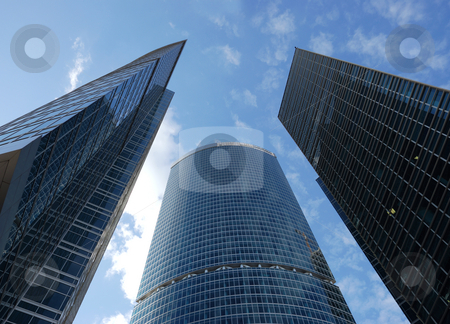 To use this stock image in your creative project, please select the size you need over to the right and click the "Add to Cart" button.
Your downloaded image will come with the Cutcaster watermark removed so don’t worry about the watermark you see on this page. Skyscrapers stock photo, A view on a three skyscrapers above by Ivan Paunovic