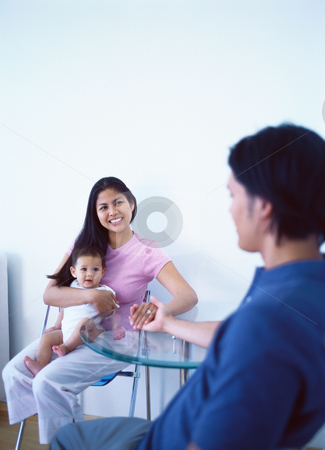 To use this stock image in your creative project, please select the size you need over to the right and click the "Add to Cart" button.
Your downloaded image will come with the Cutcaster watermark removed so don’t worry about the watermark you see on this page. MPIXIS589021 stock photo, Young family at dining table by Mpixis World