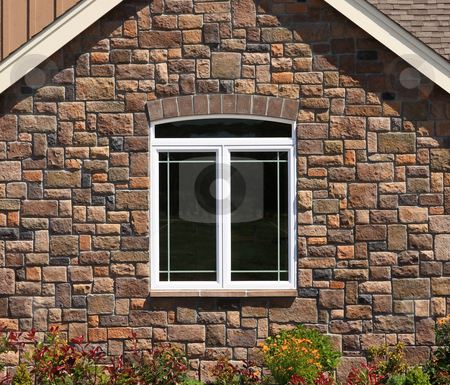 To use this stock image in your creative project, please select the size you need over to the right and click the "Add to Cart" button.
Your downloaded image will come with the Cutcaster watermark removed so don’t worry about the watermark you see on this page. House Stone Wall with Window stock photo, Brick wall with a white framed window with flowers in front. by Steve Stedman