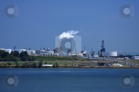 To use this stock image in your creative project, please select the size you need over to the right and click the "Add to Cart" button.
Your downloaded image will come with the Cutcaster watermark removed so don’t worry about the watermark you see on this page. Oil Refinery View stock photo, Oil refinery billowing smoke into blue sky by Steve Stedman