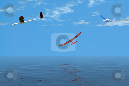 To use this stock image in your creative project, please select the size you need over to the right and click the "Add to Cart" button.
Your downloaded image will come with the Cutcaster watermark removed so don’t worry about the watermark you see on this page. Leisurely Flight stock photo, Three model airplanes flying over the ocean on a leisurely flight by Richard Nelson
