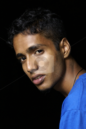 To use this stock image in your creative project, please select the size you need over to the right and click the "Add to Cart" button.
Your downloaded image will come with the Cutcaster watermark removed so don’t worry about the watermark you see on this page. Young indian man portrait stock photo, Young indian man portrait wearing blue with black background by Wong Chee Yen