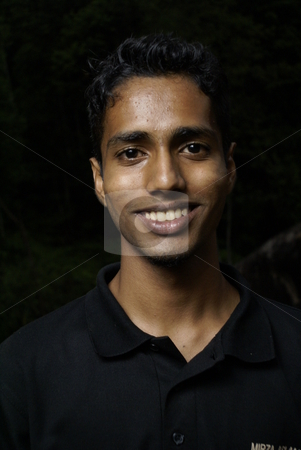 To use this stock image in your creative project, please select the size you need over to the right and click the "Add to Cart" button.
Your downloaded image will come with the Cutcaster watermark removed so don’t worry about the watermark you see on this page. Young smiling indian man portrait stock photo, Young smiling indian man portrait by Wong Chee Yen