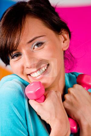 To use this stock image in your creative project, please select the size you need over to the right and click the "Add to Cart" button.
Your downloaded image will come with the Cutcaster watermark removed so don’t worry about the watermark you see on this page. I Like Fitness stock photo, Beautiful young woman curls dumbbells with a happy smile. by Vitaly Sokolovskiy