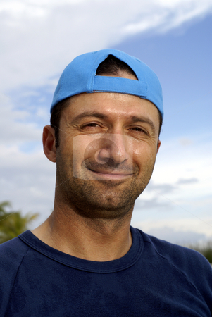 To use this stock image in your creative project, please select the size you need over to the right and click the "Add to Cart" button.
Your downloaded image will come with the Cutcaster watermark removed so don’t worry about the watermark you see on this page. Friendly caucasian man smiling outdoors stock photo, Friendly caucasian man smiling outdoors with blue reversed cap by Wong Chee Yen