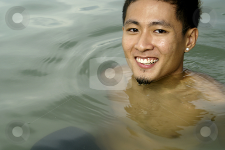 To use this stock image in your creative project, please select the size you need over to the right and click the "Add to Cart" button.
Your downloaded image will come with the Cutcaster watermark removed so don’t worry about the watermark you see on this page. Smiling asian man in water stock photo, Smiling asian man in sea water by Wong Chee Yen