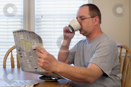 To use this stock image in your creative project, please select the size you need over to the right and click the "Add to Cart" button.
Your downloaded image will come with the Cutcaster watermark removed so don’t worry about the watermark you see on this page. Man Drinking Coffee stock photo, A man drinking his morning coffee. by Robert Byron
