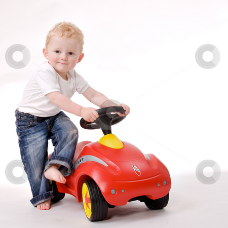 To use this stock image in your creative project, please select the size you need over to the right and click the "Add to Cart" button.
Your downloaded image will come with the Cutcaster watermark removed so don’t worry about the watermark you see on this page. Me and my red car stock photo, Cute caucasian blond toddler ishappy and playfull by Frenk and Danielle Kaufmann