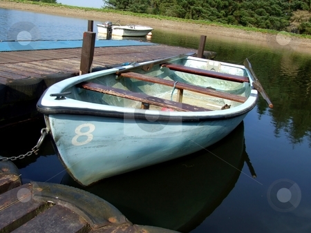 To use this stock image in your creative project, please select the size you need over to the right and click the "Add to Cart" button.
Your downloaded image will come with the Cutcaster watermark removed so don’t worry about the watermark you see on this page. Fishing boats stock photo, Empty fishing boat on the lake by Juliet Photography