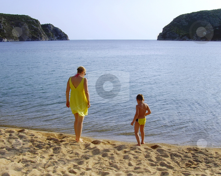 To use this stock image in your creative project, please select the size you need over to the right and click the "Add to Cart" button.
Your downloaded image will come with the Cutcaster watermark removed so don’t worry about the watermark you see on this page. Beach walk stock photo, A mother and a son enjoying by the sea by Ivan Paunovic