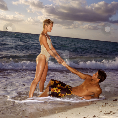 To use this stock image in your creative project, please select the size you need over to the right and click the "Add to Cart" button.
Your downloaded image will come with the Cutcaster watermark removed so don’t worry about the watermark you see on this page. MPIXIS550571 stock photo, Couple relaxing on beach by Mpixis World