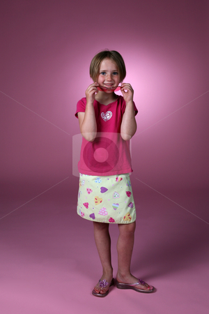 To use this stock image in your creative project, please select the size you need over to the right and click the "Add to Cart" button.
Your downloaded image will come with the Cutcaster watermark removed so don’t worry about the watermark you see on this page. Cute girl in pinks stock photo, Cute girl removing sunglasses and smiling by Sue and Shawn Roberts