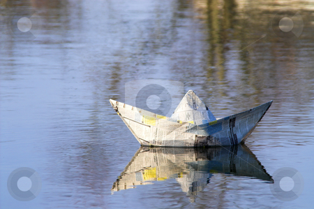 To use this stock image in your creative project, please select the size you need over to the right and click the "Add to Cart" button.
Your downloaded image will come with the Cutcaster watermark removed so don’t worry about the watermark you see on this page. Paper Boat stock photo, A paper boat sailing on the high seas. by Robert Byron