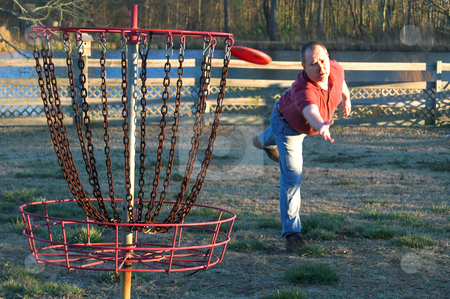 To use this stock image in your creative project, please select the size you need over to the right and click the "Add to Cart" button.
Your downloaded image will come with the Cutcaster watermark removed so don’t worry about the watermark you see on this page. Disc Golfer stock photo, A man playing a competitive round of disc golf. by Robert Byron
