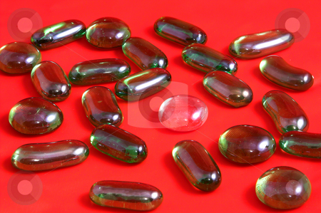 To use this stock image in your creative project, please select the size you need over to the right and click the "Add to Cart" button.
Your downloaded image will come with the Cutcaster watermark removed so don’t worry about the watermark you see on this page. Glass Stones stock photo, An assortment of glass stones used for who knows what. by Robert Byron