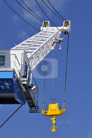 To use this stock image in your creative project, please select the size you need over to the right and click the "Add to Cart" button.
Your downloaded image will come with the Cutcaster watermark removed so don’t worry about the watermark you see on this page. Crane stock photo, Blue and white crane with a yellow hook against a blue sky by Massimiliano Leban