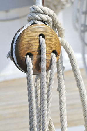 To use this stock image in your creative project, please select the size you need over to the right and click the "Add to Cart" button.
Your downloaded image will come with the Cutcaster watermark removed so don’t worry about the watermark you see on this page. Sailboat detail stock photo, Close-up of a vintage boat: wooden block and ropes by Massimiliano Leban