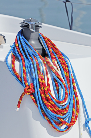 To use this stock image in your creative project, please select the size you need over to the right and click the "Add to Cart" button.
Your downloaded image will come with the Cutcaster watermark removed so don’t worry about the watermark you see on this page. Sailboat detail stock photo, Coloured ropes wrapped on a winch of a boat by Massimiliano Leban