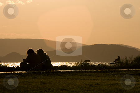 To use this stock image in your creative project, please select the size you need over to the right and click the "Add to Cart" button.
Your downloaded image will come with the Cutcaster watermark removed so don’t worry about the watermark you see on this page. Couple at sunset stock photo, Balaton, calm, clouds, evening, freetime, hills, hungary, lake, lighthouse, mole, nautic, navigation, people, portside, quiet, reflection, relax, sea, starboard, sunset, tourist, travel, walking, water, waves, wind, windy by Fesus Robert