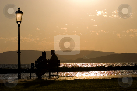 To use this stock image in your creative project, please select the size you need over to the right and click the "Add to Cart" button.
Your downloaded image will come with the Cutcaster watermark removed so don’t worry about the watermark you see on this page. Couple at sunset stock photo, Balaton, calm, clouds, evening, freetime, hills, hungary, lake, lighthouse, mole, nautic, navigation, people, portside, quiet, reflection, relax, sea, starboard, sunset, tourist, travel, walking, water, waves, wind, windy by Fesus Robert