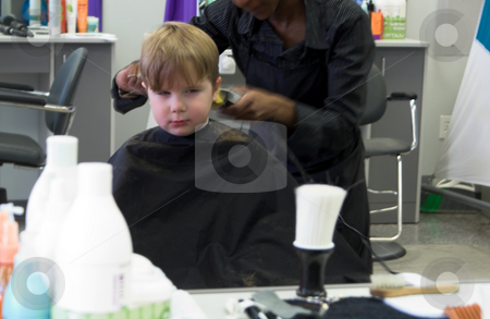 To use this stock image in your creative project, please select the size you need over to the right and click the "Add to Cart" button.
Your downloaded image will come with the Cutcaster watermark removed so don’t worry about the watermark you see on this page. Boy Getting Haircut stock photo, A young boy reluctantly getting his haircut. by Robert Byron