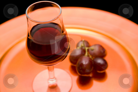 To use this stock image in your creative project, please select the size you need over to the right and click the "Add to Cart" button.
Your downloaded image will come with the Cutcaster watermark removed so don’t worry about the watermark you see on this page. Red wine and grapes on a tray stock photo, Closeup of a glass of red wine and red grapes on an orange tray. Black backround by Magdalena Ascough