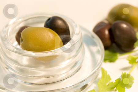 To use this stock image in your creative project, please select the size you need over to the right and click the "Add to Cart" button.
Your downloaded image will come with the Cutcaster watermark removed so don’t worry about the watermark you see on this page. Black and green olives in glass bowl stock photo, Fresh black and green olives in glass bowl by Magdalena Ascough