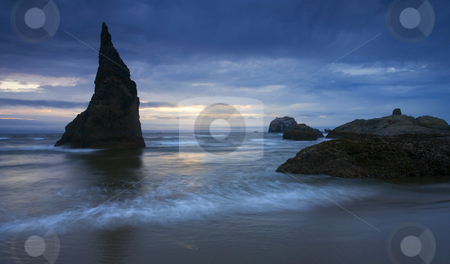 To use this stock image in your creative project, please select the size you need over to the right and click the "Add to Cart" button.
Your downloaded image will come with the Cutcaster watermark removed so don’t worry about the watermark you see on this page. Last Light stock photo, A jagged seastack silhouetted against the last hint of light of the setting sun over the beach near Bandon, ORegon. by Mike Dawson