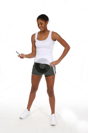To use this stock image in your creative project, please select the size you need over to the right and click the "Add to Cart" button.
Your downloaded image will come with the Cutcaster watermark removed so don’t worry about the watermark you see on this page. Black teen looking at cell phone stock photo, Pretty African American teenage girl looking at her cell phone and wearing workout clothes by Sue and Shawn Roberts