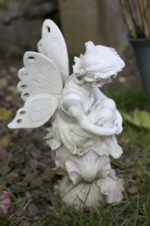 To use this stock image in your creative project, please select the size you need over to the right and click the "Add to Cart" button.
Your downloaded image will come with the Cutcaster watermark removed so don’t worry about the watermark you see on this page. Fairy stock photo, Fairy sitting and thinking by Juliet Photography