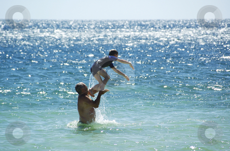 To use this stock image in your creative project, please select the size you need over to the right and click the "Add to Cart" button.
Your downloaded image will come with the Cutcaster watermark removed so don’t worry about the watermark you see on this page. Summer Fun 1 stock photo, Father and Son having fun in the water at Port Rickaby, South Australia by Irene Scales