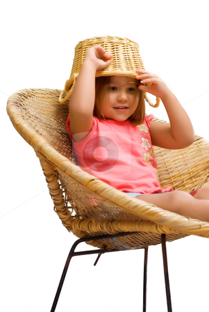 To use this stock image in your creative project, please select the size you need over to the right and click the "Add to Cart" button.
Your downloaded image will come with the Cutcaster watermark removed so don’t worry about the watermark you see on this page. Goofy Kid stock photo, A young girl sitting in a wicker chair, isolated against a white background by Richard Nelson