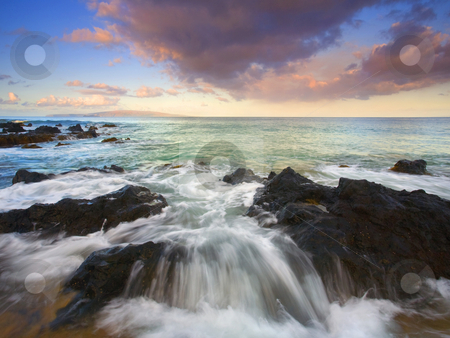 To use this stock image in your creative project, please select the size you need over to the right and click the "Add to Cart" button.
Your downloaded image will come with the Cutcaster watermark removed so don’t worry about the watermark you see on this page. Water spilling over stock photo, The rising tide spilling over a large rock formation on the beach near Kihei on Maui at sunrise. by Mike Dawson