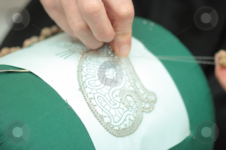 To use this stock image in your creative project, please select the size you need over to the right and click the "Add to Cart" button.
Your downloaded image will come with the Cutcaster watermark removed so don’t worry about the watermark you see on this page. Lace-making stock photo, Process of lace-making with bobbins by Natalia Macheda