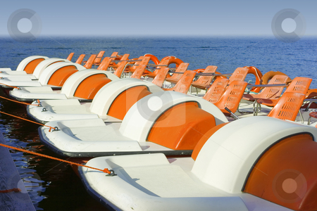 To use this stock image in your creative project, please select the size you need over to the right and click the "Add to Cart" button.
Your downloaded image will come with the Cutcaster watermark removed so don’t worry about the watermark you see on this page. Colorful catamarans on leash stock photo, Row of colorful catamarans floating leashed to quay by Natalia Macheda