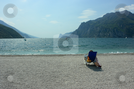 To use this stock image in your creative project, please select the size you need over to the right and click the "Add to Cart" button.
Your downloaded image will come with the Cutcaster watermark removed so don’t worry about the watermark you see on this page. Observing surfers stock photo, Lonely observer looking on surfers on Garda lake by Natalia Macheda
