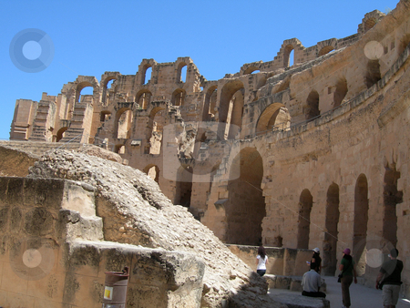 To use this stock image in your creative project, please select the size you need over to the right and click the "Add to Cart" button.
Your downloaded image will come with the Cutcaster watermark removed so don’t worry about the watermark you see on this page. Tourists at colosseum of tunisia stock photo, Roman colosseum of tunisia and tourists ancient landmarks of africa by EVANGELOS THOMAIDIS