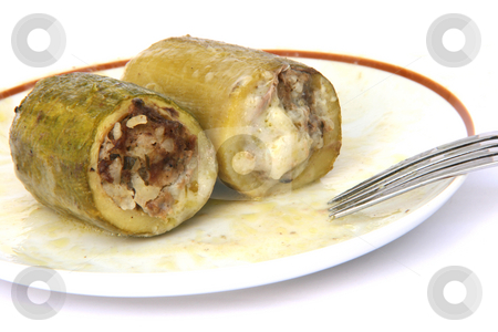 To use this stock image in your creative project, please select the size you need over to the right and click the "Add to Cart" button.
Your downloaded image will come with the Cutcaster watermark removed so don’t worry about the watermark you see on this page. Stuffed courgettes on dish stock photo, Two Baked stuffed courgettes on dish with fork isolated on white traditional greek cuisine by EVANGELOS THOMAIDIS