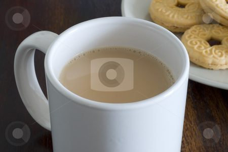 To use this stock image in your creative project, please select the size you need over to the right and click the "Add to Cart" button.
Your downloaded image will come with the Cutcaster watermark removed so don’t worry about the watermark you see on this page. Tea and biscuits stock photo, A mug of white tea and plate jam biscuits by Stephen Gibson